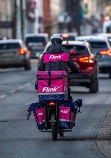 Bicycle courier of the Flink express delivery service, delivers groceries, currently in over 40