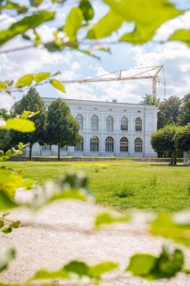 Historic building in a green park, surrounded by trees in the sunshine, Weimar, Germany