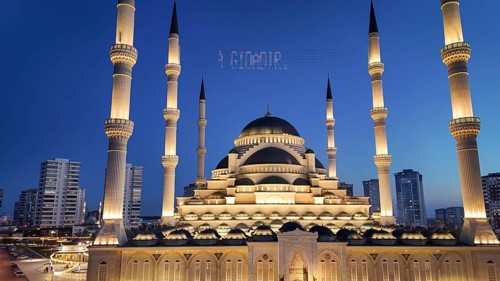 Aerial view captures hundreds of Muslims gathered at long tables for a communal Iftar meal in a
