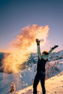 Summit bliss in the snow-covered winter landscape in the Tannheimer Tal in the Alps on the