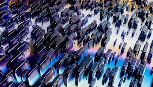 A captivating arrangement of metallic 3D shapes in varying sizes against an iridescent gradient