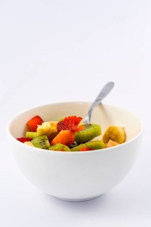 Recipe of a fruit salad with kiwis, strawberries, bananas finished