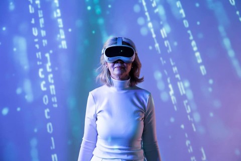 An elderly Asian woman, wearing a VR headset, explores the metaverse, surrounded by digital