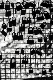 Padlocks, so-called love locks on a fence, vantage point in Wesel am Rhein, North Rhine-Westphalia,