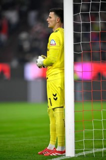 Goalkeeper Michael Zetterer SV Werder Bremen SVW (01) leans against goalpostsAllianz Arena, Munich,