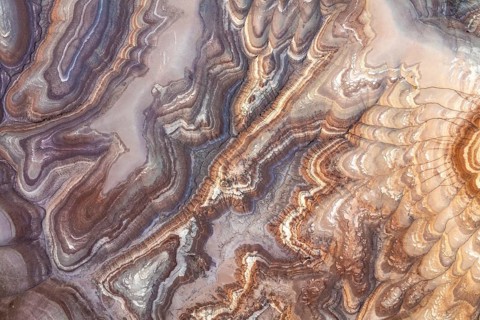 Aerial capture of bentonite sandstone formations in Utah, USA, showcasing intricate patterns and