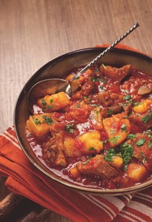 Potatoes with meat, stewed in tomato sauce, with spices and herbs, homemade, no people