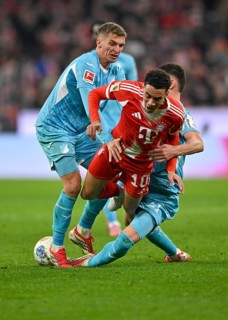 Tackle, action Jamal Musiala FC Bayern Munich FCB (10) against Albian Hajdari TSG 1899 Hoffenheim