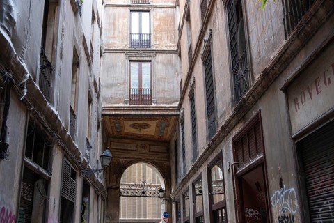 Alley and building bridge in the historic centre of Barcelona, Spain