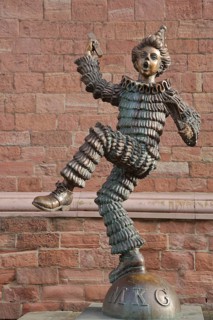 Sculpture of the Mainzer Klepper-Garde, jester with ruff on ball with inscription MKG, carnival