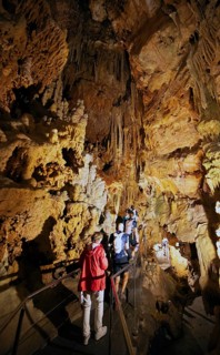 Cave with illuminated stalactites and stalagmites, stalactite cave, Diros Cave, Glyfada Cave,