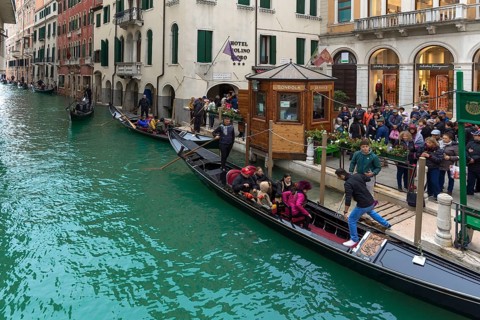Tourists board gondola for round trip, Venice, Veneto, Italy