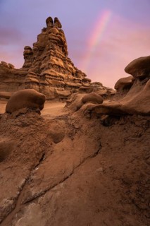 Captivating view of unique sandstone formations under a colorful sky in Goblin Valley State Park,