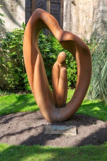Sculpture by artist Naomi Blake 1980 'Refugee' garden of Bristol cathedral church, Bristol,