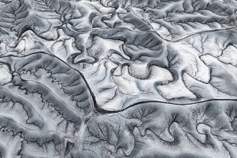 Stunning aerial shot capturing the intricate, textured patterns of erosion at Moonscape Overlook in