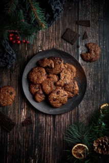 Top view of some tasty chocolate cookies with Christmas decoration