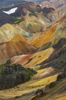 Small river between colourful rhyolite mountains, volcanic landscape, erosion landscape, view from