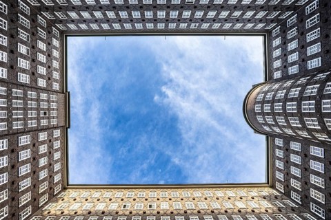 View of the sky in the courtyard of the Chilehaus in the Kontorhausviertel, Hamburg, Germany