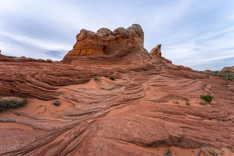 Striking red sandstone formations with intricate patterns in White Pocket, Arizona, epitomize the