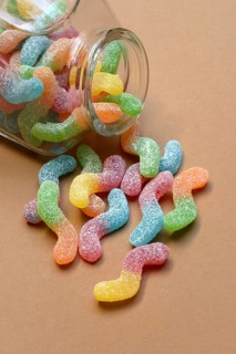 Lots of colorful jelly sweets with glass containers