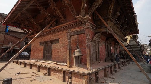 Traditional Nepalese building, temple with detailed wooden architecture and support beams after the