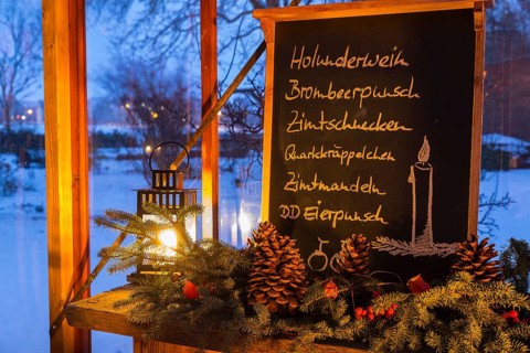 Christmas decoration, still life in a winter garden with blackboard with lettering such as