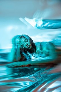A futuristic African young woman immersed in the digital metaverse, showcasing a blend of