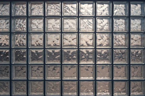 Aesthetic and modern design of textured glass block wall, capturing abstract patterns and light