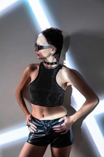 A futuristic cyberpunk fashion model showcases an edgy and dynamic look with metallic accents, bold