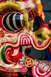 Close-up image of a vibrant and colorful Chinese dragon costume used in the New Year celebrations,