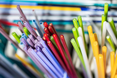 A vibrant collection of Murano and Burano glass rods in a spectrum of colors. This Venetian glass