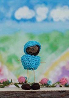 Chestnut figure with hat and jumper in the studio