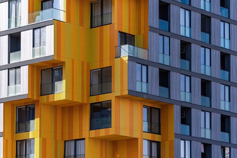 A striking example of modern architecture utilizing a mix of glass, concrete, and metal, featuring