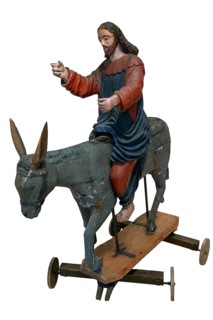 Christ on the palm donkey, on a white background, wooden figure from around 1400, Museum Bezau,