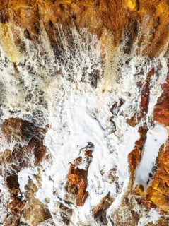 Detail of a waterfall in the Rio Tinto (Red river) with its orange-red hue due to oxidised iron