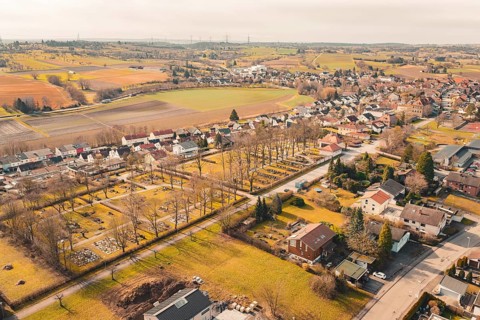 Nice view of a village with trees and fields, the cemetery is visible, Ötisheim, Enzkreis, Germany