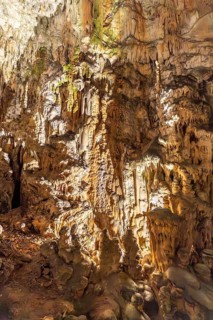 Breathtaking view of illuminated stalactites and stalagmites formations inside postojna cave, a