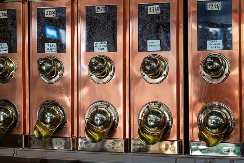 Old-fashioned brass coffee bean collector in a roastery in Barcelona, Spain