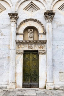 Entrance to the church of San Frediano, historic city centre, Lucca, Tuscany, Italy