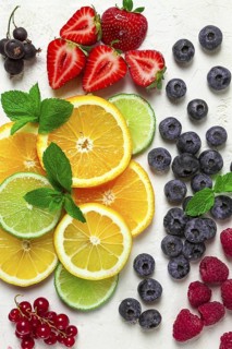 Mix of fruits and berries, set, assortment, sliced citrus fruits, raspberries, blueberries, mint
