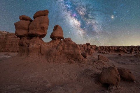 Captivating view of the Milky Way galaxy shining brightly over the unique hoodoo rock formations of
