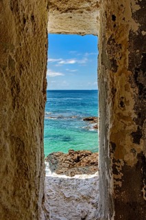 Sea of ??the city of Salvador in Bahia seen through a small window in a sentry box in the historic