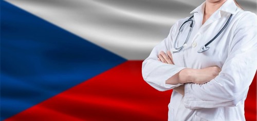 Doctor with crossed arms on Czech Republic flag. Czech Republic health and care concept. Female