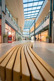 Interior view of a modern shopping centre with long bench and glass roof, Sterncenter Sindelfingen,