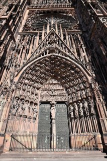 Strasbourg, France, September 2023: Gothic style entrance door with tympanum of west facade of