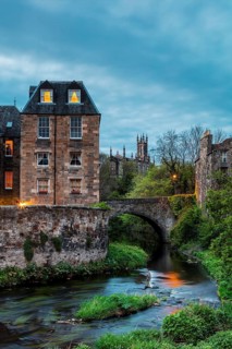 Dean Village, Edinburgh, Scotland, UK. Traditional houses and church with canal in historic Dean