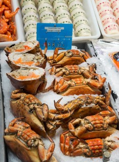 Fresh crabs and other seafood on ice presented on a market stall, fish market, Trouville-sur-Mer,