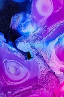Vivid abstract liquids art featuring swirling patterns in shades of blue and purple, creating a
