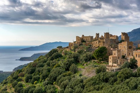 A view of Vathia, a historic abandoned village in Mani Peninsula, Greece, with traditional stone