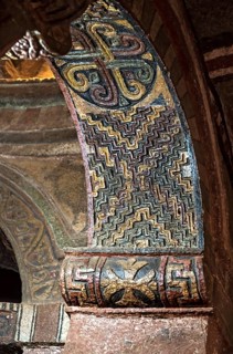 Arched vault with the seal of Lalibela carved in stone and coloured geometric ornaments, monolithic